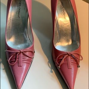 Dolce & Gabbana magenta pumps.
